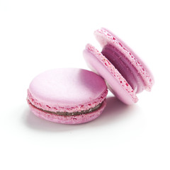Two macaroons on white background