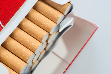 Open pack of cigarettes isolated