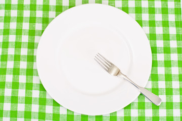 White Plate on a Checkered Tablecloth with Place for Your Text
