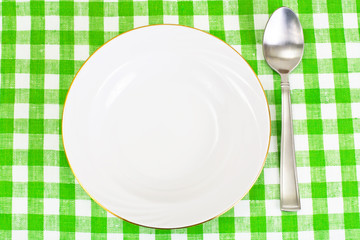 White Plate on a Checkered Tablecloth with Place for Your Text