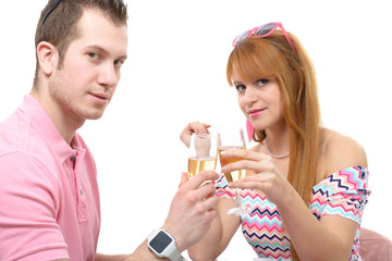 Happy young couple drinking glass of champagne