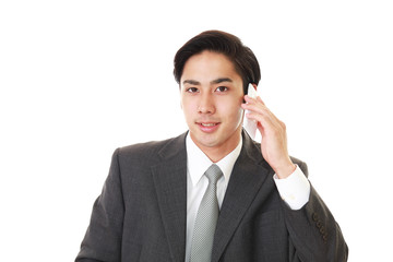 通話中の笑顔のビジネスマン