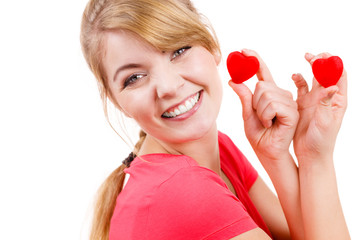 Funny woman holds red hearts love symbol