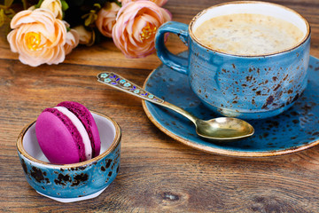 Obraz na płótnie Canvas Sweet French Macaroons with Cofee Cup