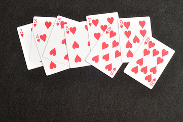 Playing card. Two to ten of hearts isolated on a black background
