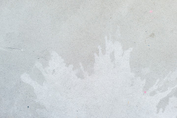 White splash on gray background concrete wall, messy, splotchy, surface. Decorative wet paint...