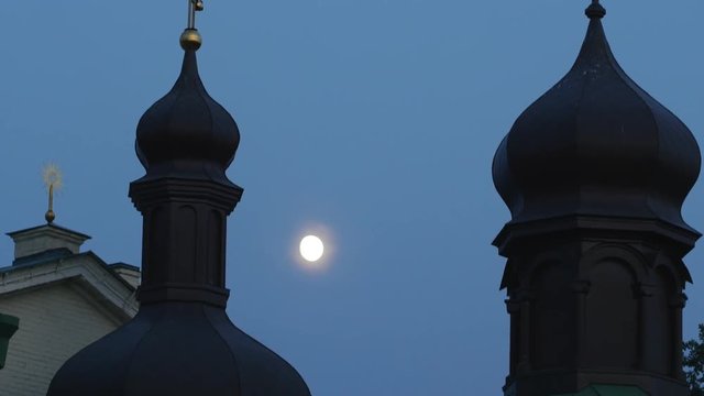 Cupolas' Silhouettes Church in the Evening Moon is Shining Holy Trinity Jonah's Monastery Panorama of a Bell Towers Golden Crosses Kiev Ukraine