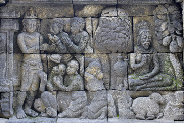 Detail of Buddhist carved relief in Borobudur temple