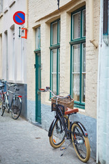 Bicycle against brick wall in Brugge