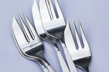 Stainless steel forks on a table