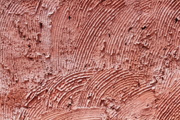 Red concrete wall background.Walls with rough surfaces.