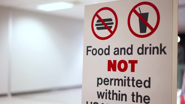 Food and drinks are prohibited behind this sign.