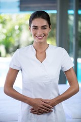 Portrait of confident female masseur