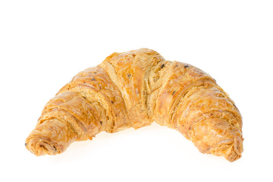 fresh croissant with nuts and raisins on white