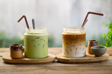 ice latte coffee and matcha green tea on wood table