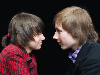 Teenagers - man and woman. Persons close to the profile. Relationship adolescent first love feelings.