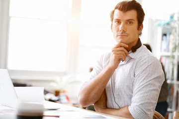 Naklejka premium Young businessman in office