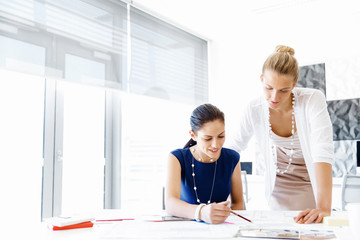 Two female colleagues in office