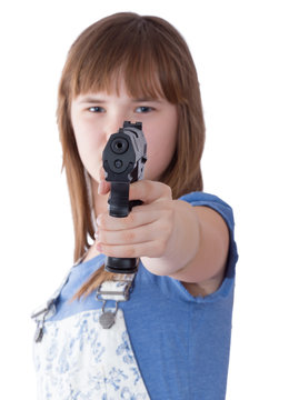 Pretty teen girl with a gun