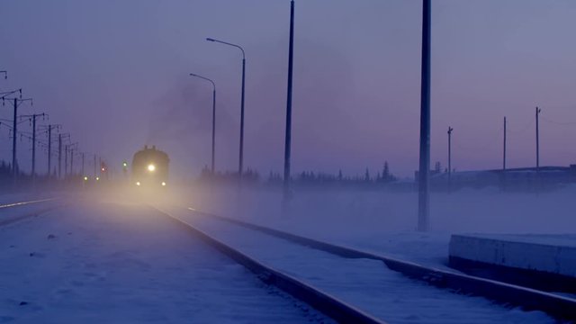 Moving train in winter night