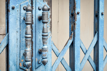 Blue steel door handles of the old sliding door (door, handle, vintage) 
