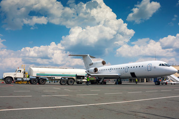 Fototapeta na wymiar Refueling plane at a small airport
