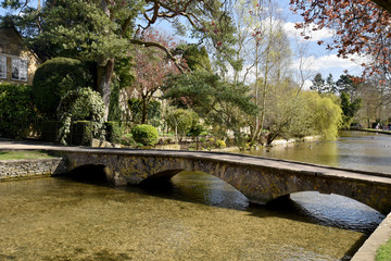 Footbridge over River Windrush in Bourton-on-the-Water, Cotswolds, Gloucestershire