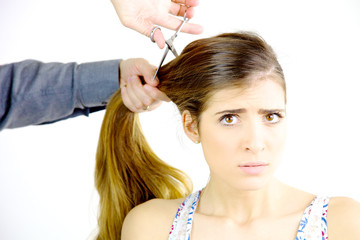 Naklejka premium Woman scared about getting all her big long hair cut off