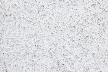 Grunge dry peeling white paint on wood.