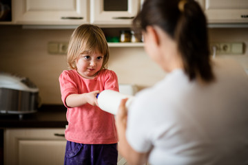 Mother and daughter baking together