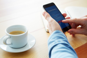 Male hands using mobile banking