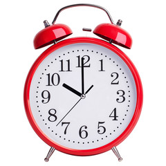 Red alarm clock shows exactly ten