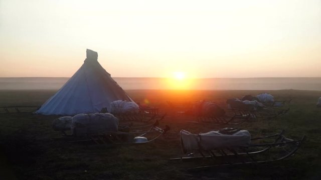 Lonely chum in the tundra. Sunrise. 