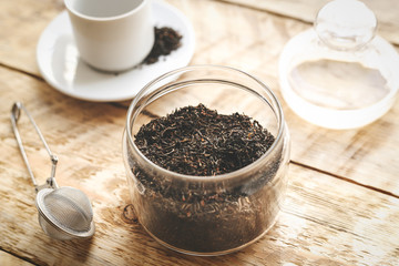 Tea set on the wooden table at sunny morning