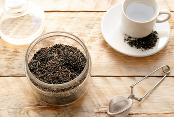 Tea set on the wooden table at sunny morning