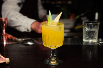 Fresh cocktail with orange and ice, selective focus