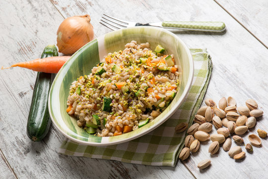 barley risotto with zucchinis carrots and pistachio nut