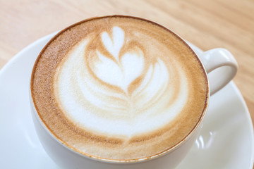 Latte Coffee art on the wooden table