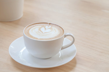 Latte Coffee art on the wooden table