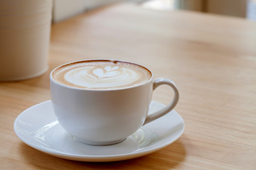 Latte Coffee art on the wooden table