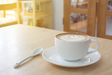 Latte Coffee art on the wooden table