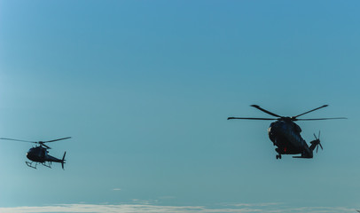 Flight of military helicopters,helicopters in the sky