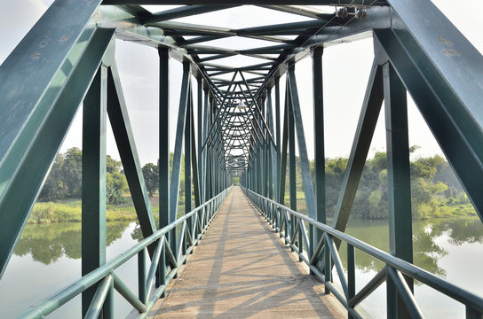 Fototapeta The old iron bridge in midday (Select focus)  