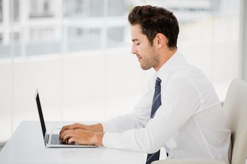 Businessman working on laptop