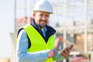 Portrait of an attractive worker on a construction site