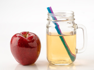 jug of apple juice on withe