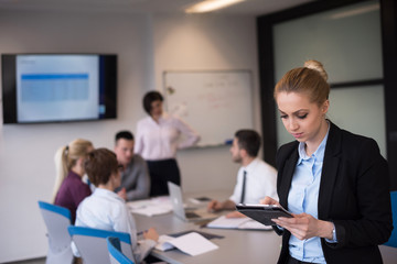 business woman working on tablet at meeting room