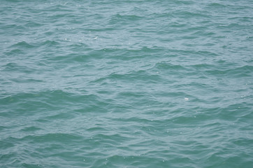 Blue sea surface in midday
