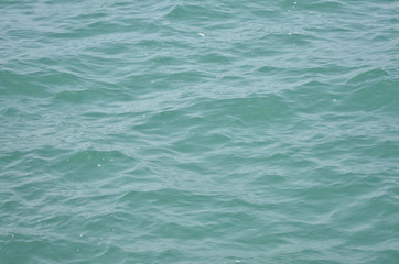 Blue sea surface in midday
