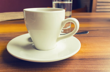 Freshly brewed coffee in a white cup, retro